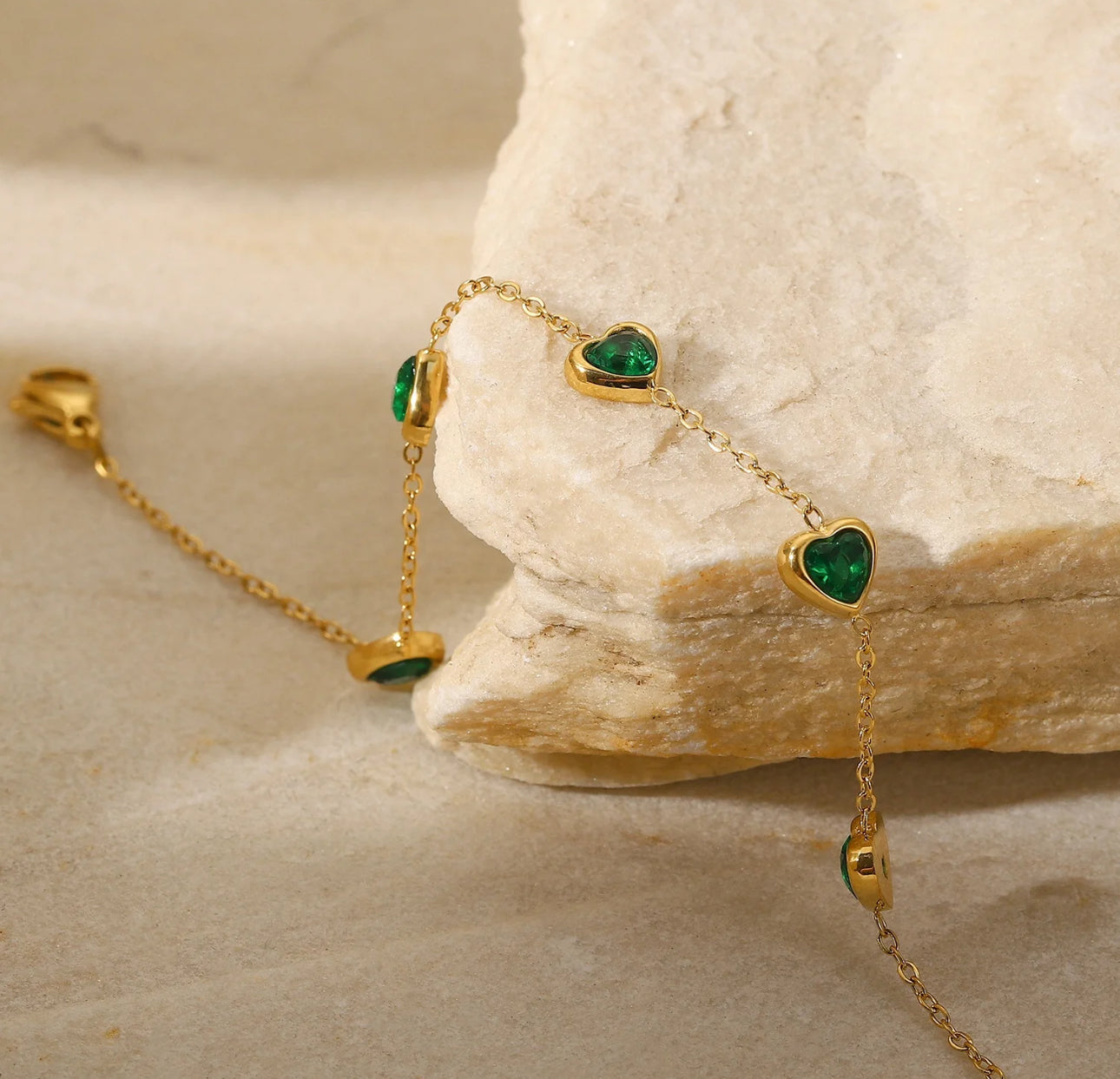 Heartfelt Charm Gold Bracelet with Emerald Accents