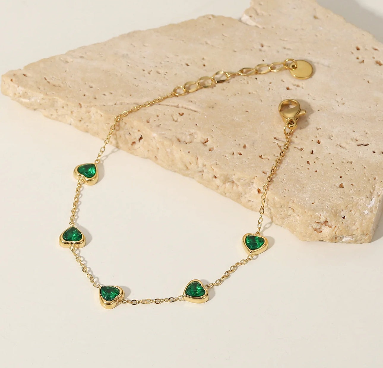 Heartfelt Charm Gold Bracelet with Emerald Accents