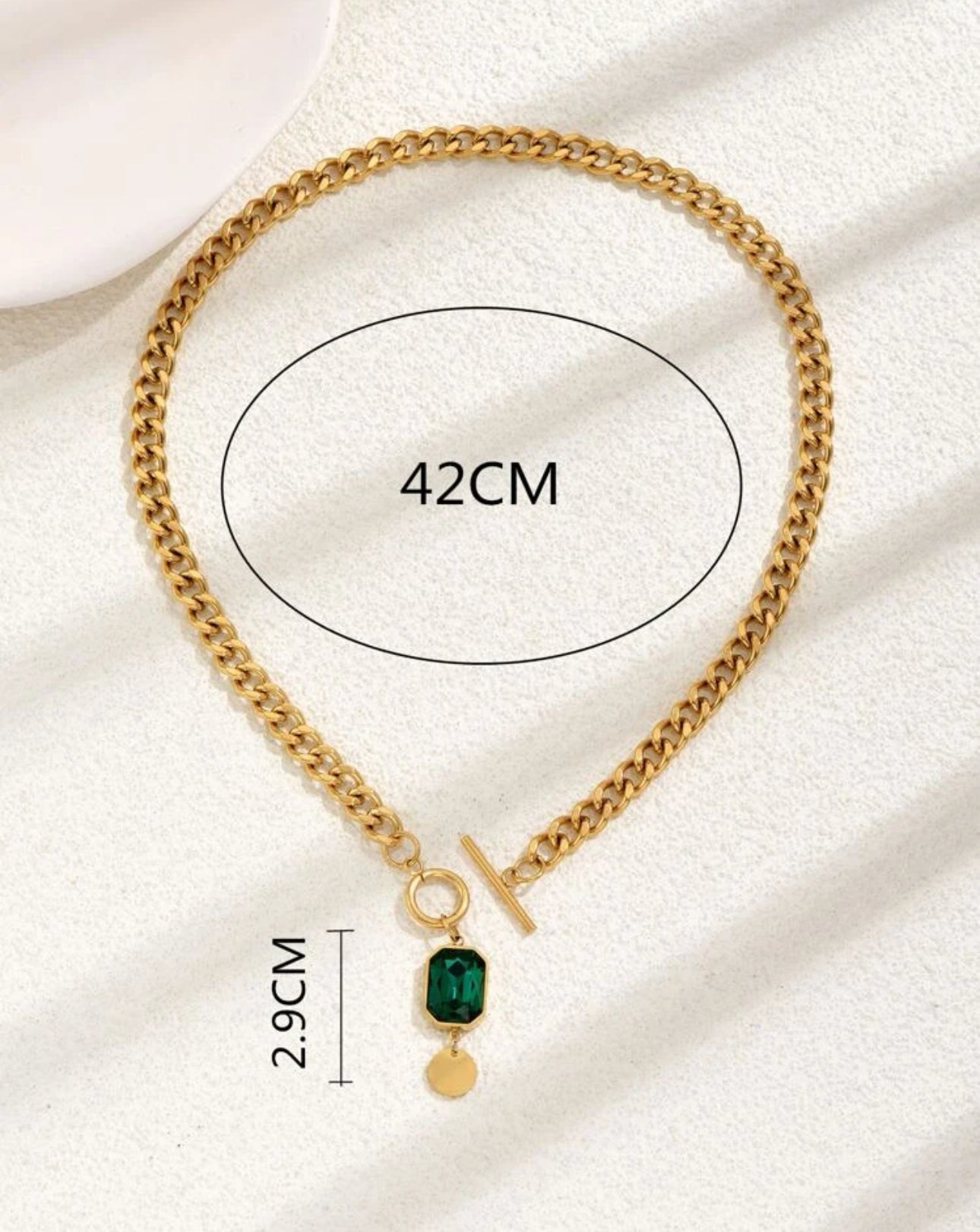 Elegance Unlocked: Golden Lurex Necklace with Emerald Pendant