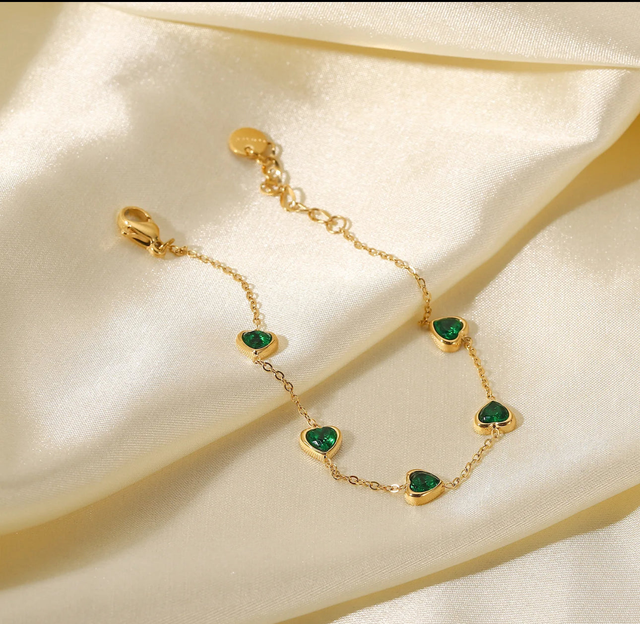 Heartfelt Charm Gold Bracelet with Emerald Accents