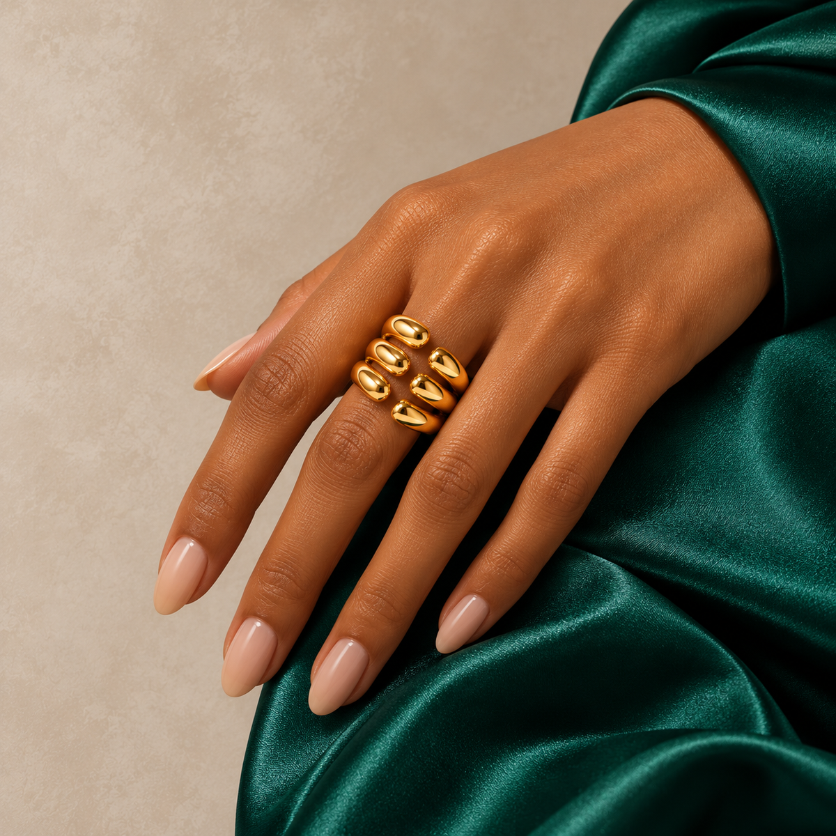Time & Candy ring styled with emerald green and warm neutral tones
